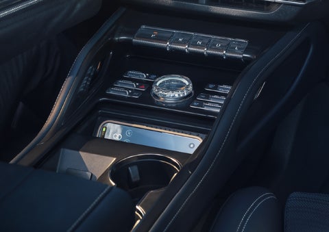 A smartphone is shown charging in the wireless charging pad. | Covert Lincoln Austin in Austin TX